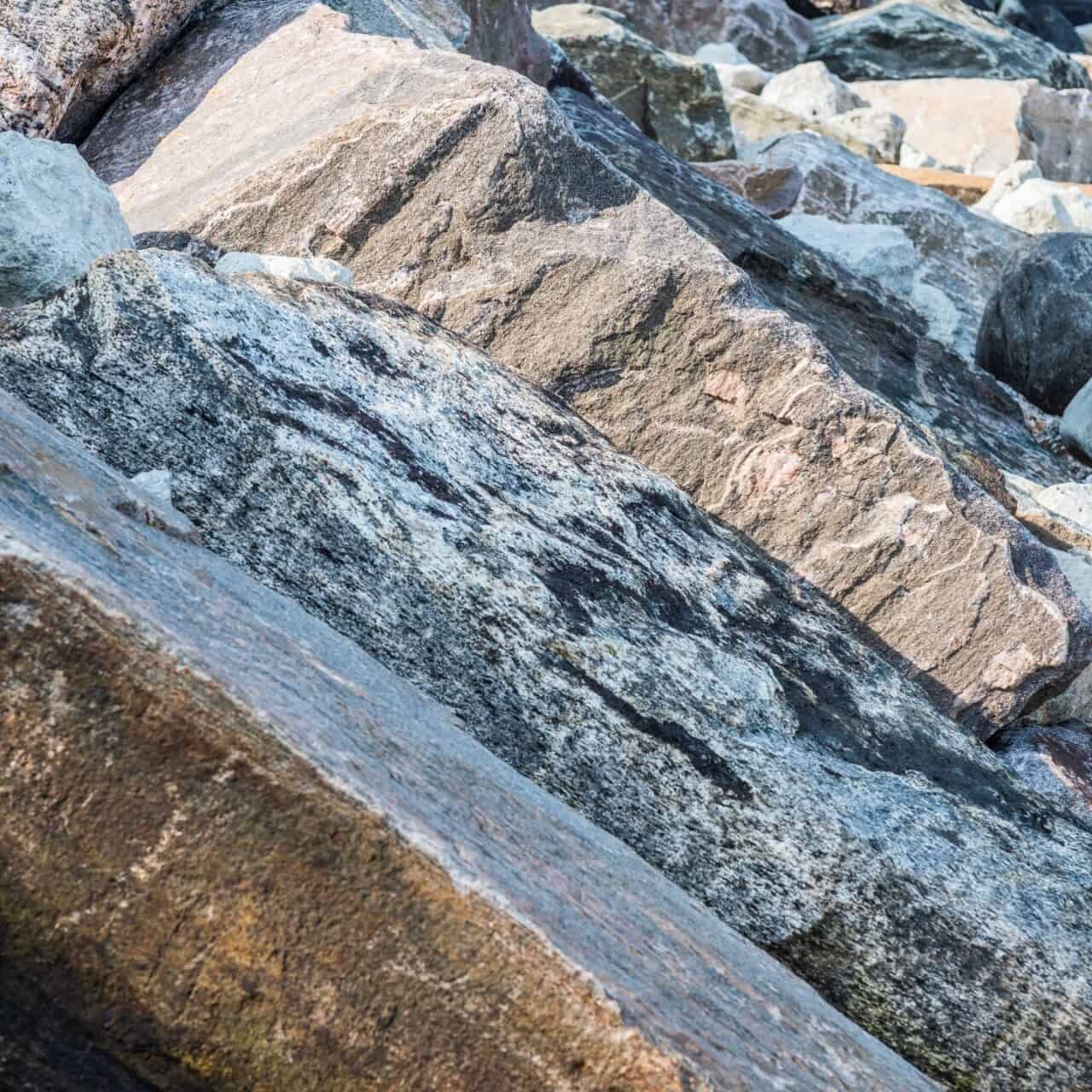 Large granite boulders protect against waves and ice on georgian bay.